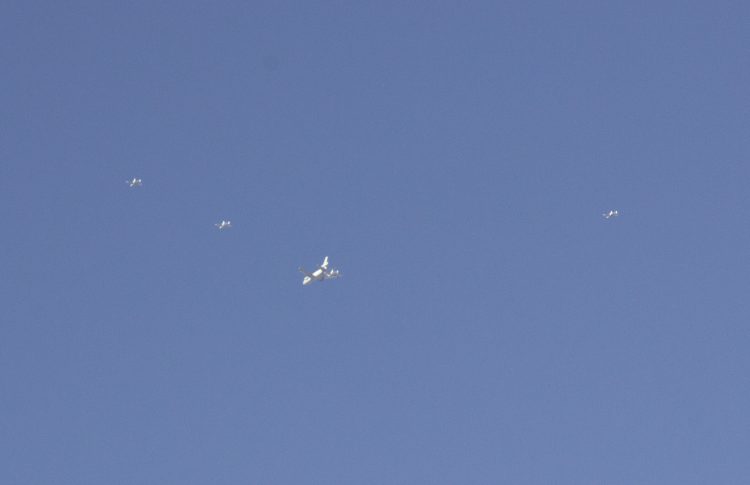 Photograph by “The Messenger” of 5 planes (one near wing of larger plane and 6th out of frame) viewed by office workers on Friday, November 8, 2019, at 10:30 AM Mountain time south of Grand Junction, Colorado. The Messenger says that after taking two photos of the 6 planes making “a tremendous and thunderous sound that came abruptly without warning .... that within 30 seconds (after taking 2 photos), the 'Six Jets' had visibly and audibly disappeared without a trace within a 180-degree-view at nearly 200 miles of unobstructed view across from the north, west and south — all had vanished.” Further, “They didn't show on radar with online radar maps” (accessible to Messenger and office colleagues, profession unstated).  Click to enlarge photo.