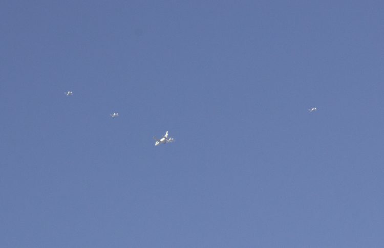 Photograph by “The Messenger” of 5 planes (one near wing of larger plane and 6th out of frame) viewed by office workers on Friday, November 8, 2019, at 10:30 AM Mountain time south of Grand Junction, Colorado. The Messenger says that after taking two photos of the 6 planes making “a tremendous and thunderous sound that came abruptly without warning .... that within 30 seconds (after taking 2 photos), the 'Six Jets' had visibly and audibly disappeared without a trace within a 180-degree-view at nearly 200 miles of unobstructed view across from the north, west and south — all had vanished.” Further, “They didn't show on radar with online radar maps” (accessible to Messenger and office colleagues, profession unstated). Click to enlarge photo.