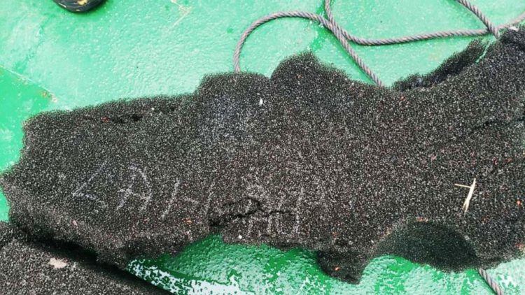 A handout photo released by the Chilean Air Force on December 11, 2019, shows a numbered part of a fuel tank, allegedly from the C-130 Hercules military transport plane that mysteriously went missing with 38 people aboard on December 10, 2019 over Drake Passage. Numbered debris found floating on the waters of the Drake Passage between the southern tip of Chile and the Antarctic Peninsula.
