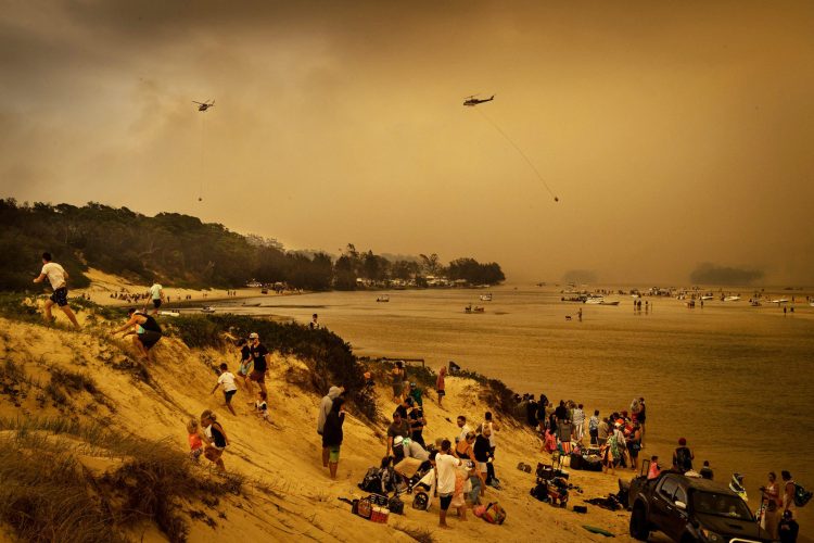 The NSW beach town of Mallacoota, Australia, and other towns north and south had fires chasing residents and tourists to the beach where thousands of people waited to be rescued. Image by NSW Rural Fire Service.