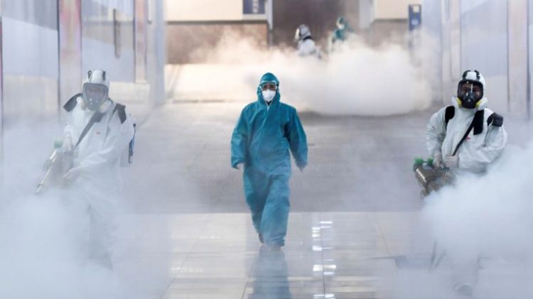 U. K.'s Sky News image on February 4, 2020, of China crew spraying streets and sidewalks with virus-killing chemicals in urgent effort to stop rapidly spreading Wuhan coronavirus as more than 20,000 cases and 427 deaths confirmed.