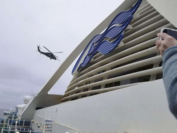 A California Air National Guard helicopter delivered virus testing kits hovering above the Grand Princess cruise ship Thursday, March 5, 2020, off the coast of San Franciso. There are about 3,500 passengers and everyone needs to be tested for the COVID-19 coronavirus. Results are not expected before Friday night, March 6, 2020. Photo: Michele Smith / Associated Press.