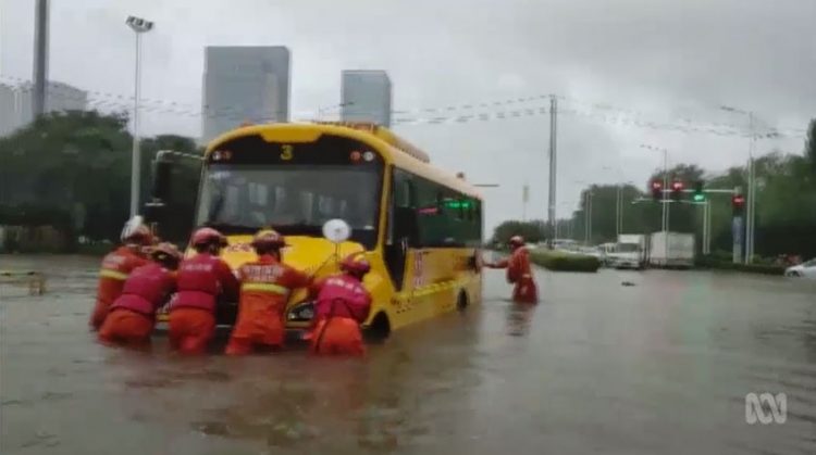 Bus trapped in deep flood waters on July 20, 2021, in Zhengzhou, China. Click to enlarge.