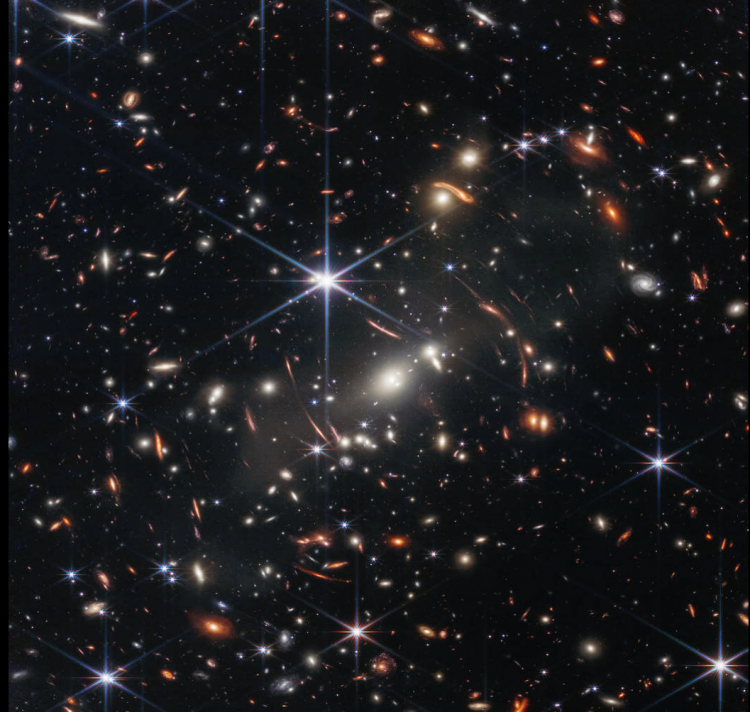 NASA reports that this Webb's First Deep Field image of the galaxy cluster SMACS 0723 is the highest resolution image of the infrared universe anyone has ever seen, according to NASA. NASA Administrator Bill Nelson told President Joe Biden at the White House on Monday, July 11, 2022, that light travels at 186,000 miles per second, meaning that the light observed in a single “speck” within the image has been traveling for 13+ billion years. The goal is to get back to the beginning of this universe approximately 13.6 billion years ago. Webb will also reveal chemical composition of atmospheres around planets beyond our solar system. Targets of those studies include Procyon A and B 11.46 light-years from Earth and the TRAPPIST-1 solar system 39.46 light-years from Earth that has seven planets. Image released July 11, 2022, from the James Webb Space Telescope. 
